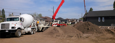 Truck pumping concrete for foundation of Thunder Bay home
